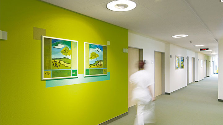 Nurse is walking in a corridor lit by Philips at the psychiatric clinic