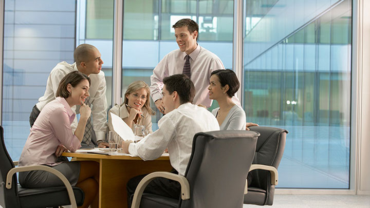 People around a table discussing about a project