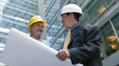 An advisor and a worker discussing about a project